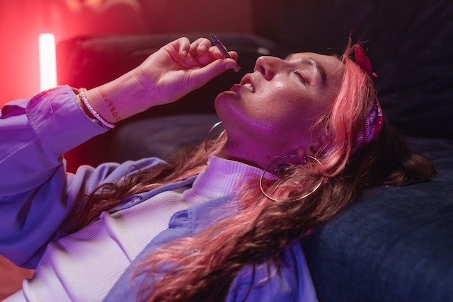 Woman smoking marijuana.