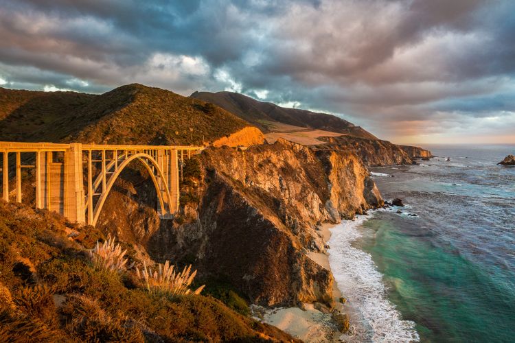 cliffside bridge by the ocean in california